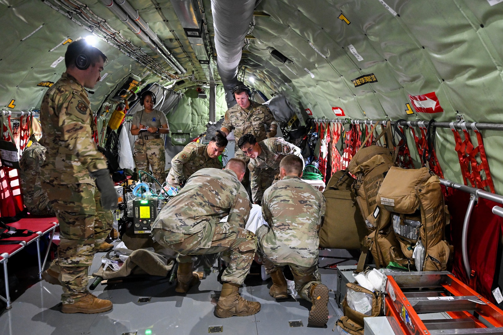 A group of 59th Medical Wing Airmen place a simulated patient and secure their liter onto a KC-135 Stratotanker, Joint Base San Antonio-Kelly Field Annex, Texas, June 18, 2024.