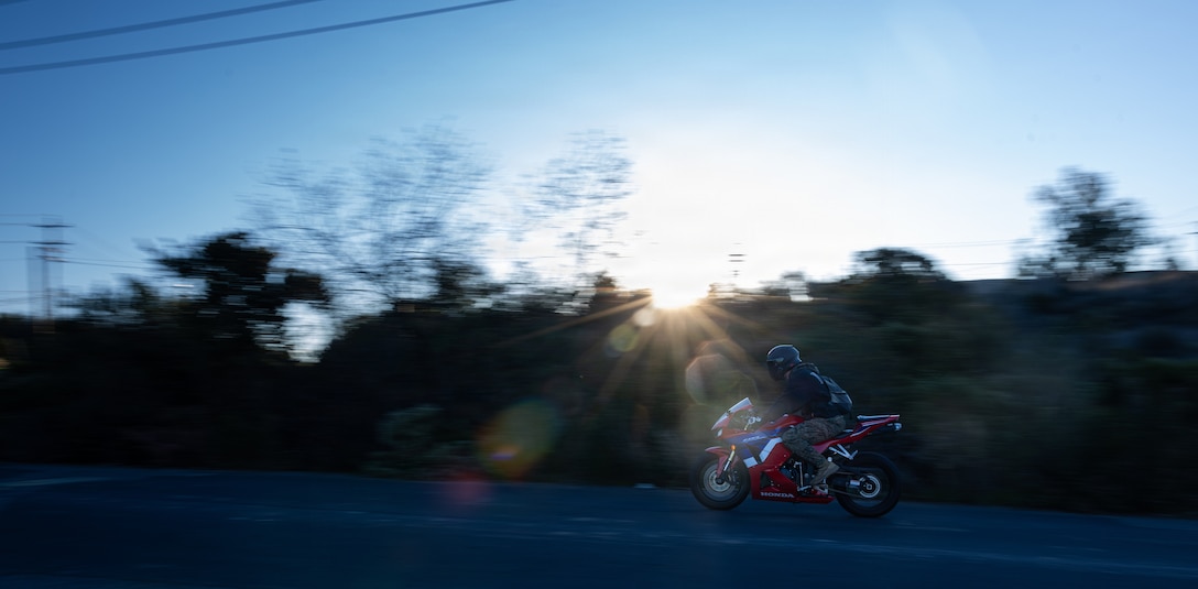U.S. Marines and civilians with the Provost Marshal's Office with Headquarters and Support Battalion conduct personal protective equipment, registration, and insurance inspections during Operation Full Stop at Marine Corps Base Camp Pendleton, California, Dec. 1, 2025. Operation Full Stop is designed to ensure 100% compliance with motorcycle personal protective equipment and legal regulations. (U.S. Marine Corps photo by Cpl. Jacqueline Akamelu)