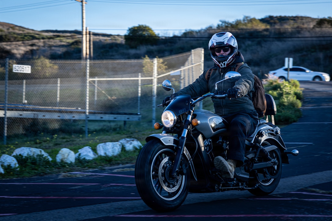 U.S. Marines and civilians with the Provost Marshal's Office with Headquarters and Support Battalion conduct personal protective equipment, registration, and insurance inspections during Operation Full Stop at Marine Corps Base Camp Pendleton, California, Dec. 1, 2025. Operation Full Stop is designed to ensure 100% compliance with motorcycle personal protective equipment and legal regulations. (U.S. Marine Corps photo by Cpl. Jacqueline Akamelu)