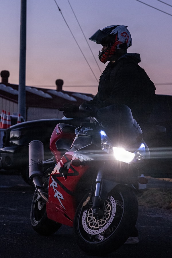U.S. Marines and civilians with the Provost Marshal's Office with Headquarters and Support Battalion conduct personal protective equipment, registration, and insurance inspections during Operation Full Stop at Marine Corps Base Camp Pendleton, California, Dec. 1, 2025. Operation Full Stop is designed to ensure 100% compliance with motorcycle personal protective equipment and legal regulations. (U.S. Marine Corps photo by Cpl. Jacqueline Akamelu)