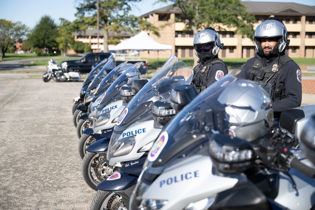 Person sits on motorcycle.
