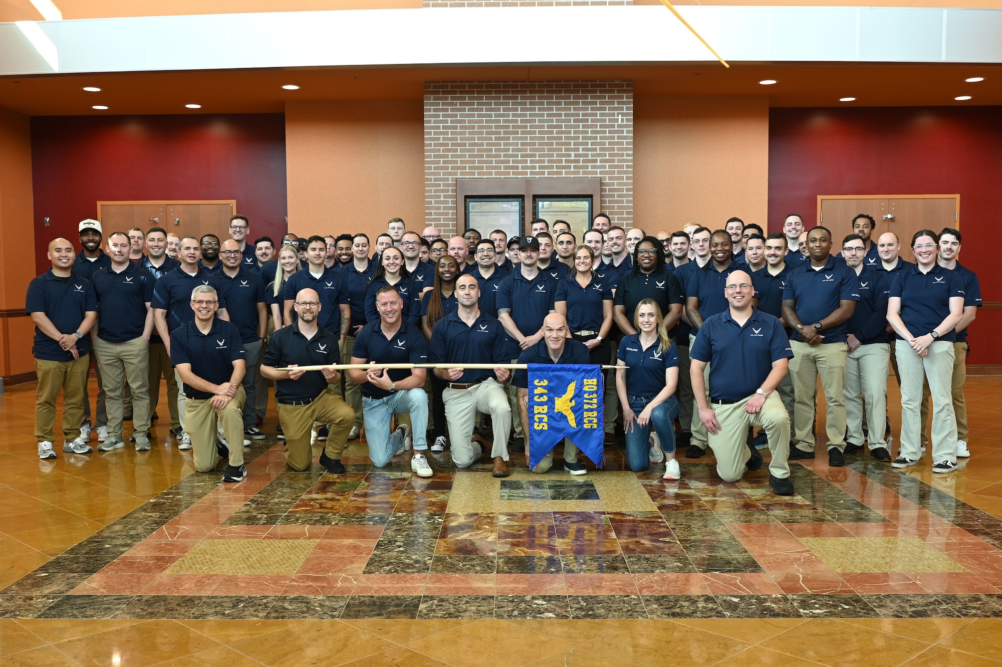Members of the 343rd Recruiting Squadron gather for a squadron photo at their semi-annual training conference in La Vista, Nebraska, July 14, 2025.