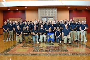 Members of the 343rd Recruiting Squadron gather for a squadron photo at their semi-annual training conference in La Vista, Nebraska, July 14, 2025.