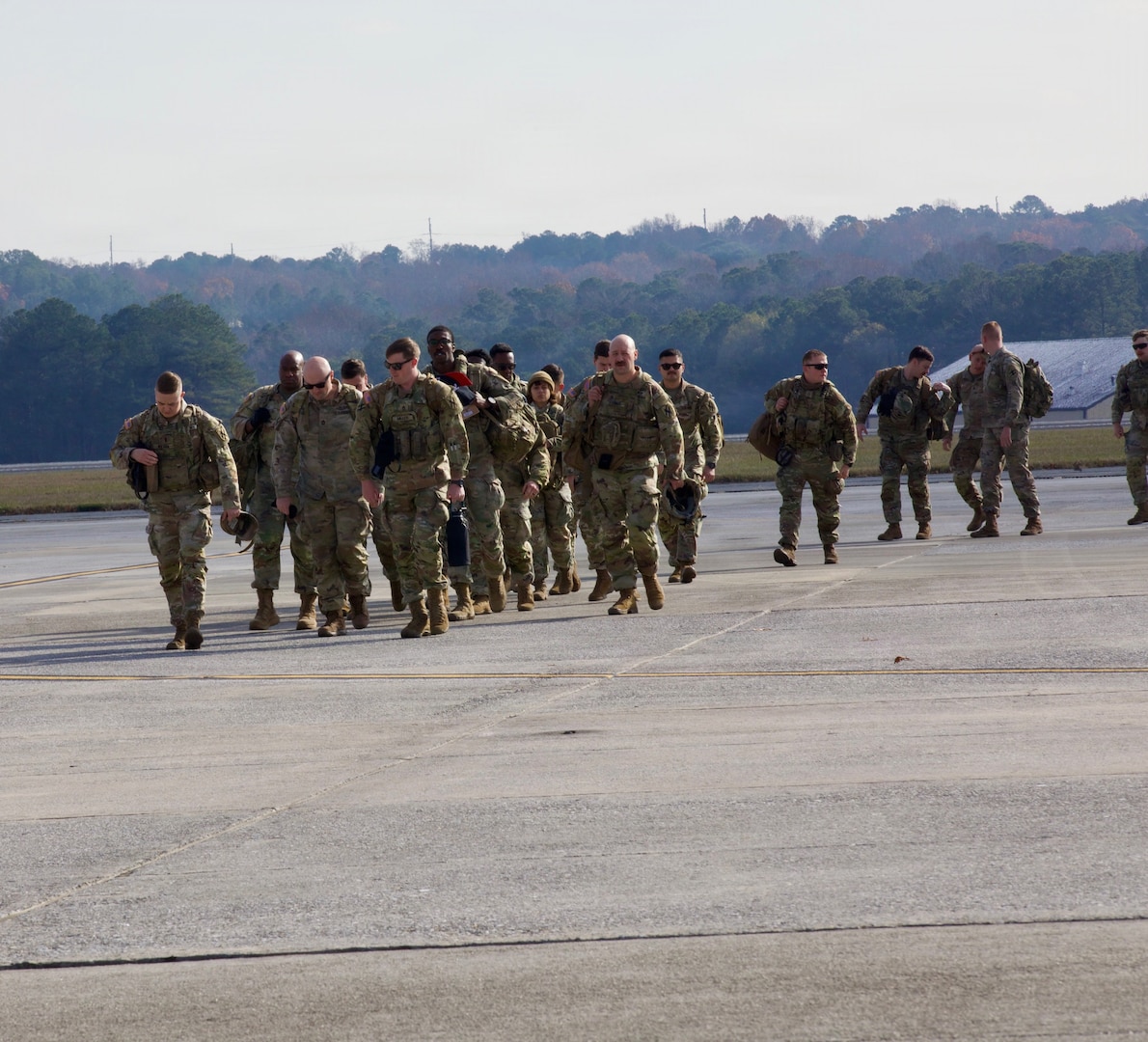 U.S. Army Soldiers with the 170th Military Police Battalion walk from a C-130 on Dobbins Air Reserve Base after returning home from D.C., December 9, 2025. The unit supported the D.C. Safe and Beautiful mission by providing critical assistance to the Metropolitan Police Department and community partners to enhance public safety and quality of life throughout the district.
