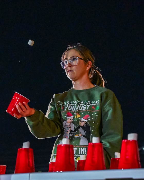 A military spouse plays a festive game, Dec. 5, 2025, at Luke Air Force Base, Arizona.
