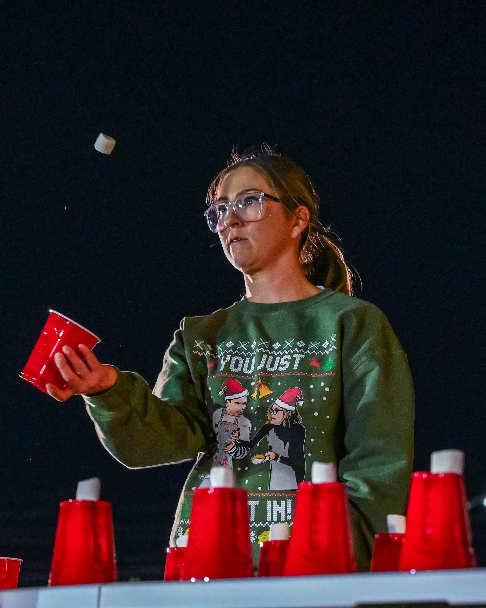A military spouse plays a festive game, Dec. 5, 2025, at Luke Air Force Base, Arizona.