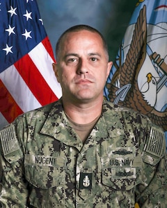 A picture of a navy chief petty officer in his utility uniform.