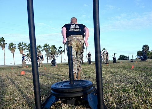 Guardian Arena competitors push their physical limits during the third annual Guardian Arena at Patrick Space Force Base, Fla., Dec. 9, 2025. Thirty-five teams, comprised of U.S. Space Force Guardians, U.S. Air Force Airmen, civilians, and representatives from international allies and partners, took part in the world’s largest Space Force exercise. The competition emphasizes the importance of cultivating a combat-ready mindset, connecting military and civilian space enterprises, and building esprit de corps by putting the Guardian Ideals into action. (U.S. Air Force photo by Chad Trujillo)