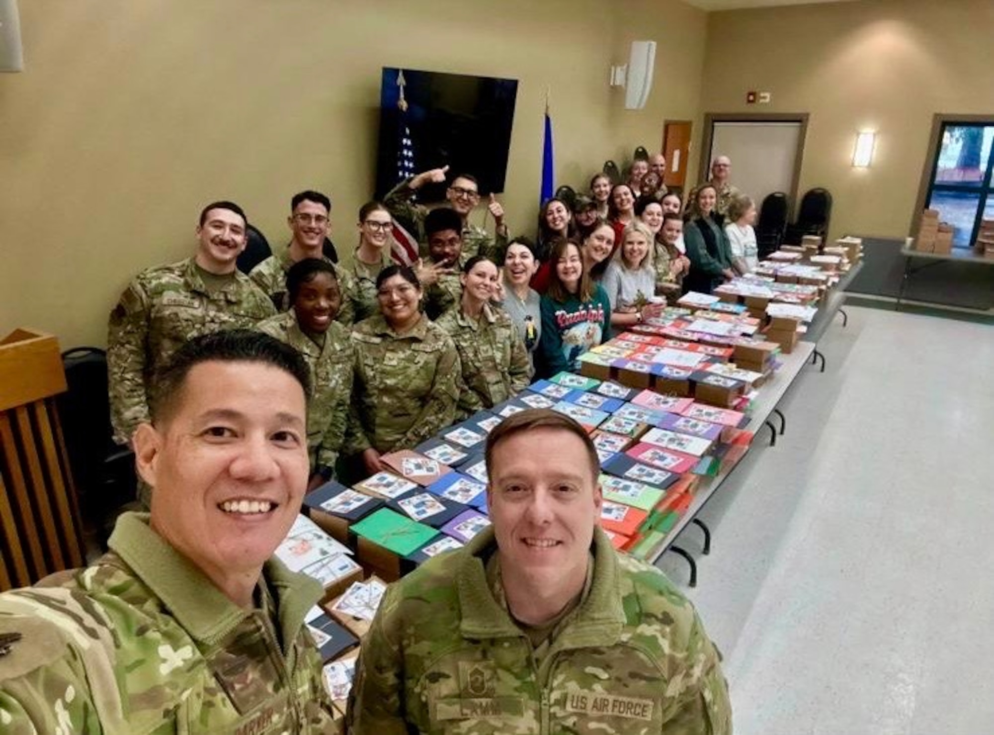 A photo of base leadership posing for a photo with the volunteer team.