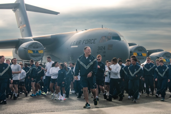 A photo of several people finishing a run.