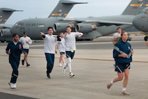A photo of several people running.