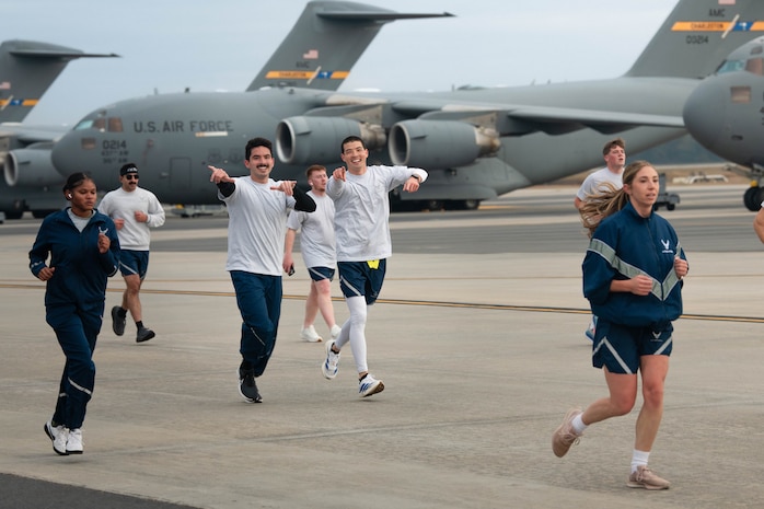 A photo of several people running.