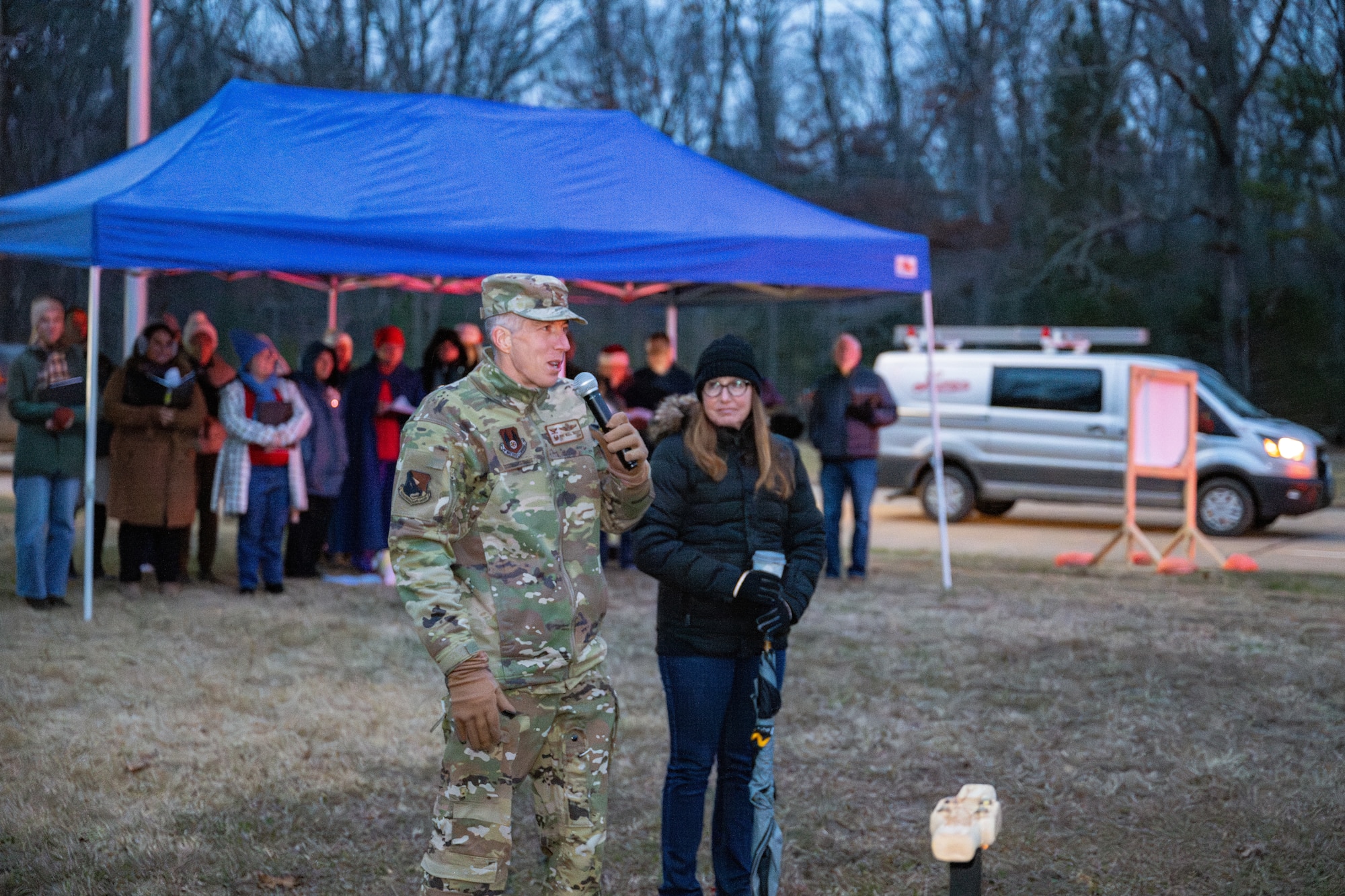 Arnold Engineering Development Complex Commander Col. Grant Mizell welcomes the crowd at the Arnold Air Force Base Christmas tree lighting ceremony Dec. 4, 2025. Pictured to Mizell’s left is his wife, Evelyn. The Christmas tree at Arnold AFB, Tenn., headquarters of AEDC, was purchased in 2023 after installation leadership expressed a desire for a Christmas tree to be displayed at a prominent location on the base. The tree measures 40 feet tall and 22 feet wide. It is decorated with approximately 300 ornaments and is topped with a 5-foot 3D five-point star. (U.S. Air Force photo by Keith Thornburgh)