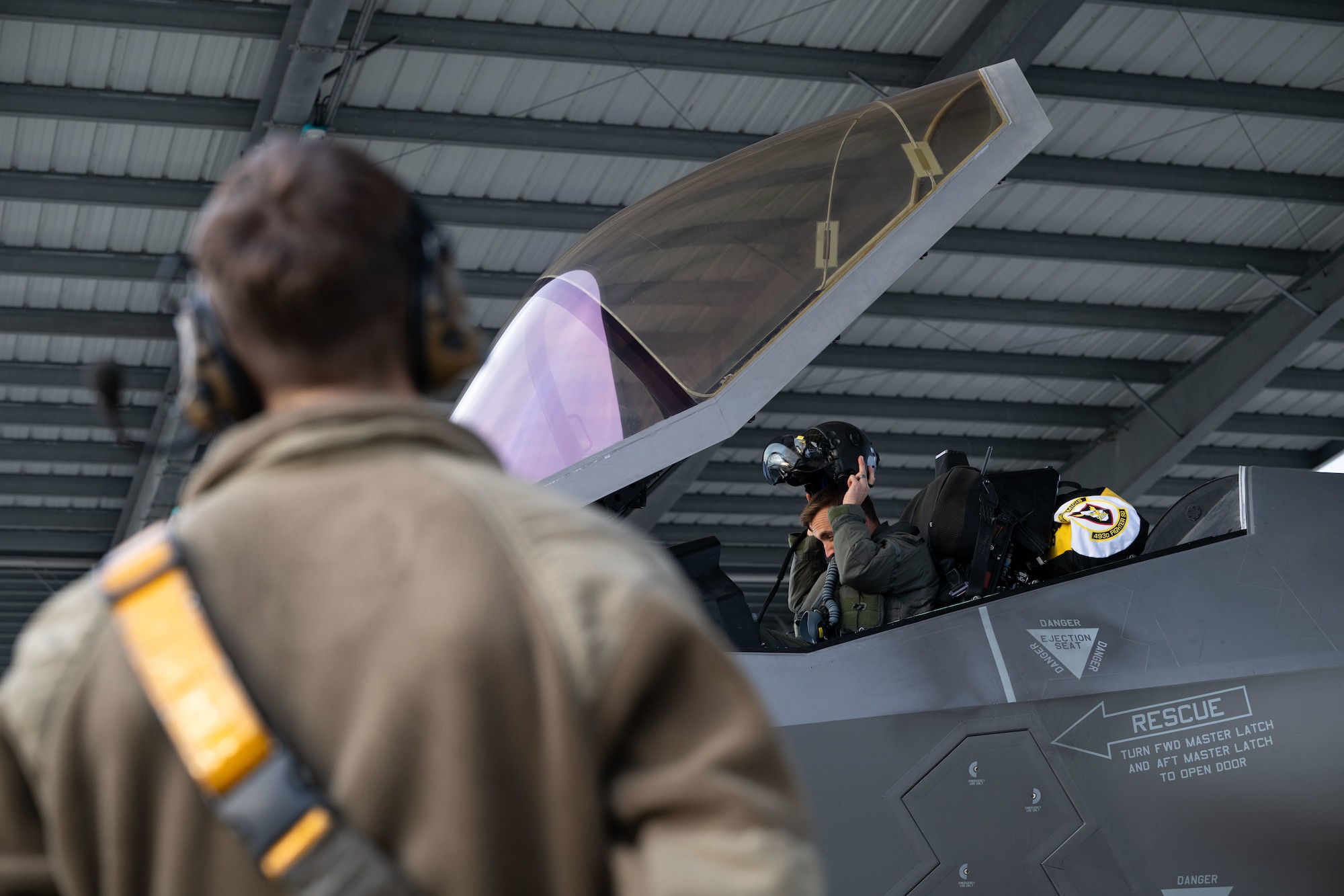 U.S. Air Force Senior Airman Jayden Archuleta, 493rd Fighter Generation Squadron crew chief, monitors the flight preparations for a F-35 Lightning II aircraft before a training mission over the Baltic states from RAF Lakenheath