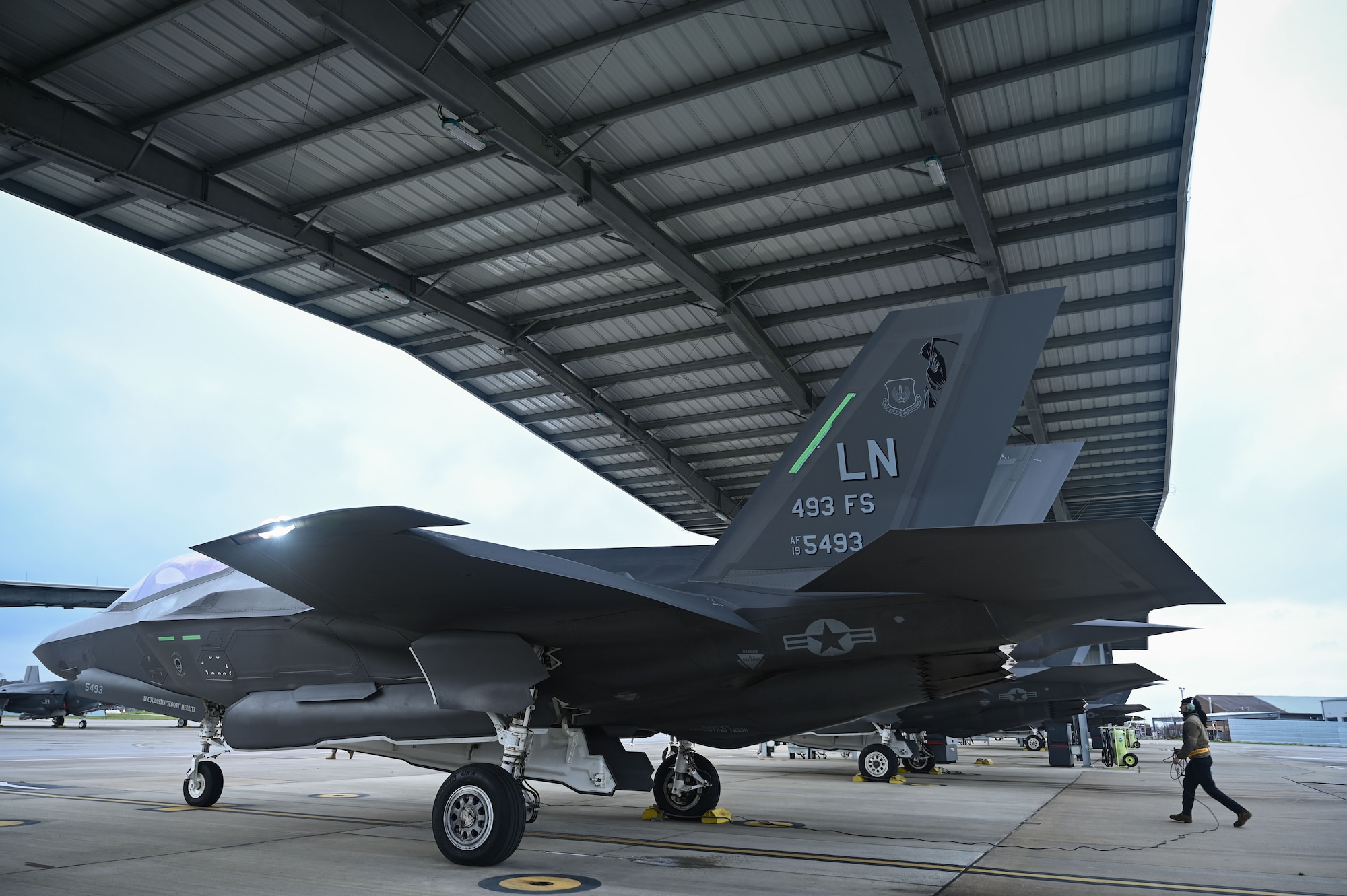 U.S. Air Force Airman 1st Class Angelina Alvarez, 493rd Fighter Generation Squadron crew chief, performs preflight checks on a F-35 Lightning II before a training mission across the Baltic states, from RAF Lakenheath