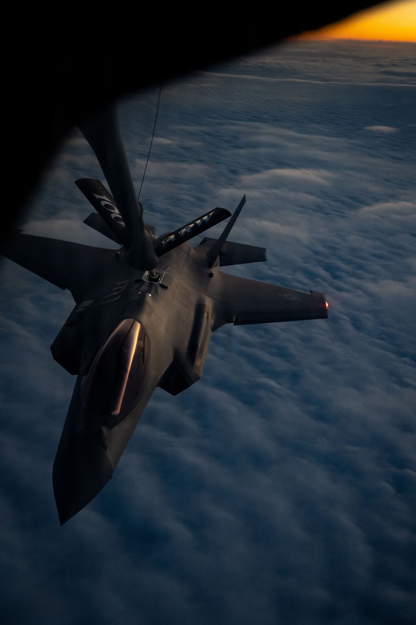 A U.S. Air Force 48th Fighter Wing F-35 Lightning II receives fuel from a 100th Air Refueling Wing KC-135 Stratotanker over the Baltic Sea