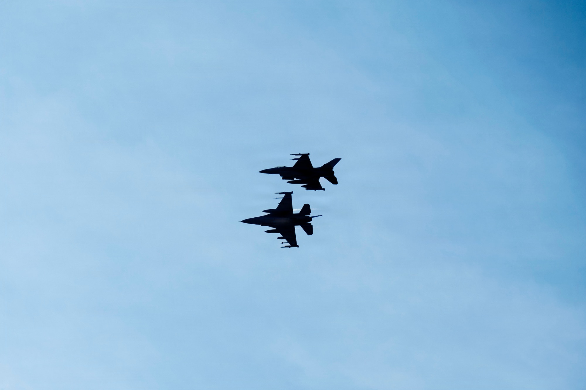 Two U.S. Air Force F-16 Fighting Falcons, assigned to the 510th and 555th Fighter Generation Squadrons at Aviano Air Base, Italy, prepare to land during routine Agile Combat Employment operations at Campia Turzii, Romania