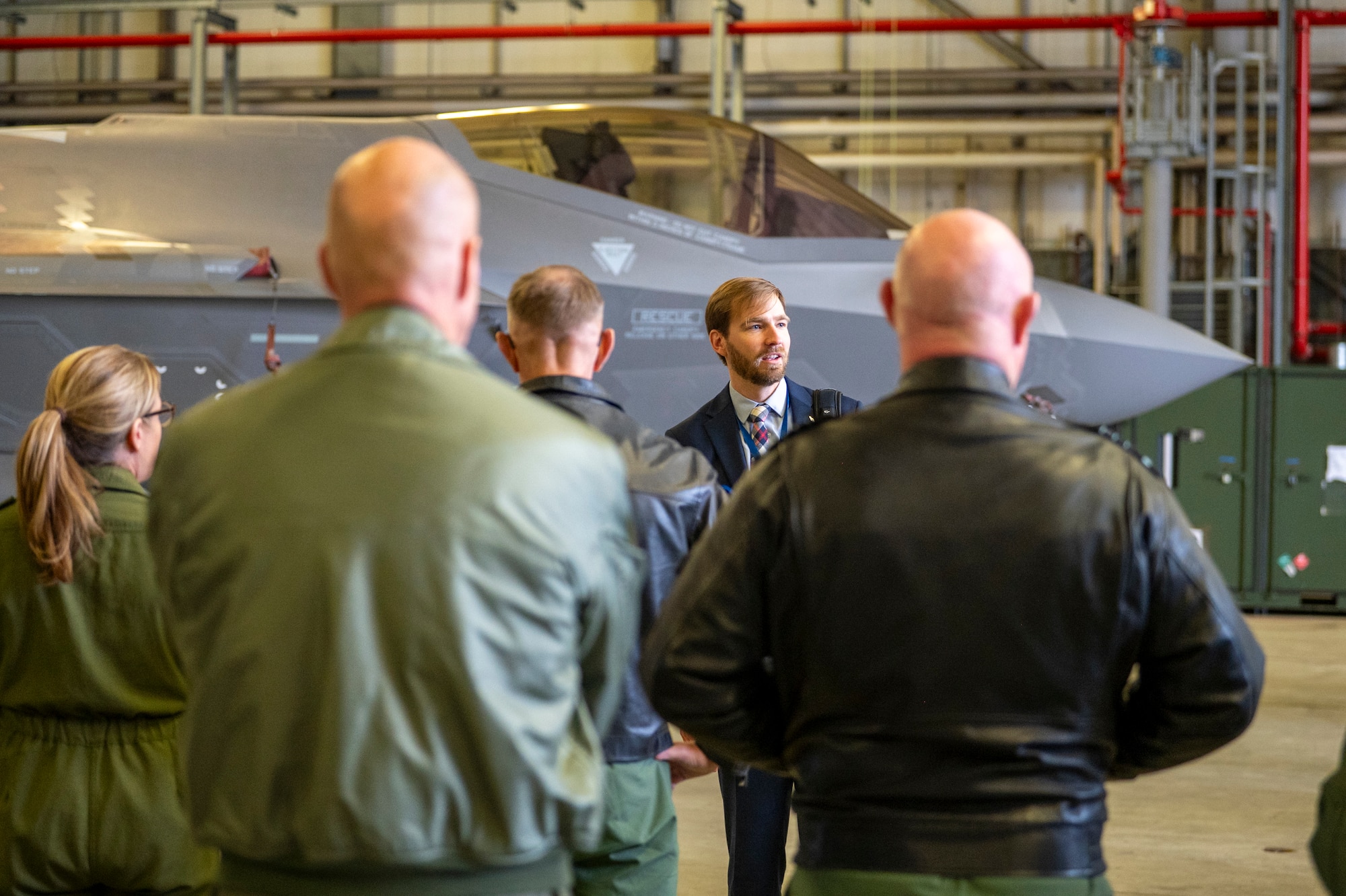 Brendon Andrus, U.S. Air Forces in Europe – Air Forces Africa, Fifth Generation Integration branch chief, speaks with members of the European Air Chiefs in front of a U.S. Air Force F-35A Lightning II assigned to the 48th Fighter Wing located at RAF Lakenheath, England, prior to a cross-servicing weapons load demonstration at Ramstein Air Base, Germany