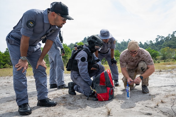U.S. Navy Sailors assigned to Explosive Ordnance Disposal Mobile Unit (EODMU) 11 and Royal Malaysian Navy (RMN) explosive ordnance disposal (EOD) technicians prepare a demolition range during Cooperation Afloat Readiness and Training (CARAT) Malaysia 2025 in Lumut, Malaysia, Dec. 8, 2025.