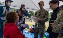 JOGASHIMA PARK, Japan (Nov. 9, 2025) — A U.S. Navy Hospital Corpsman assigned to U.S. Navy Medicine Readiness and Training Command Yokosuka works with Japanese responders to assess and treat a simulated casualty during Big Rescue Kanagawa 2025. The annual exercise is one of Kanagawa Prefecture’s largest disaster-response drills, involving U.S. Naval Hospital Yokosuka, Red Cross Yokosuka and Branch Health Clinic Atsugi personnel working alongside U.S. and Japanese agencies. (U.S. Navy photo by Daniel Taylor/USNMRTC Public Affairs)