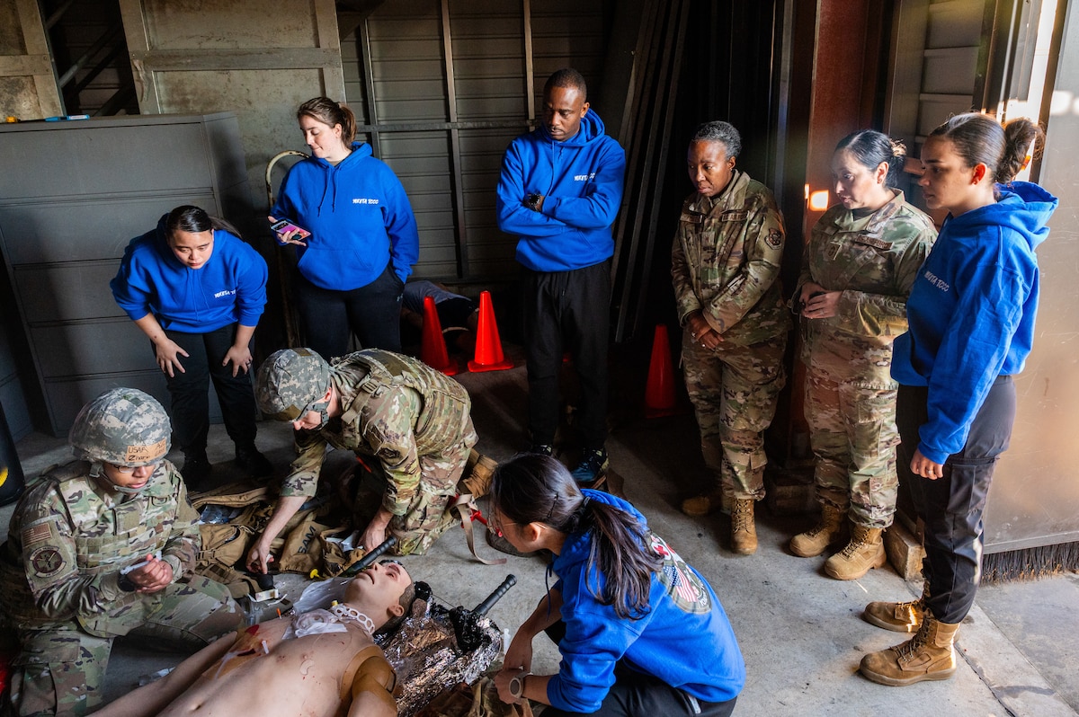 Airmen perform TCCC on simulated patients.