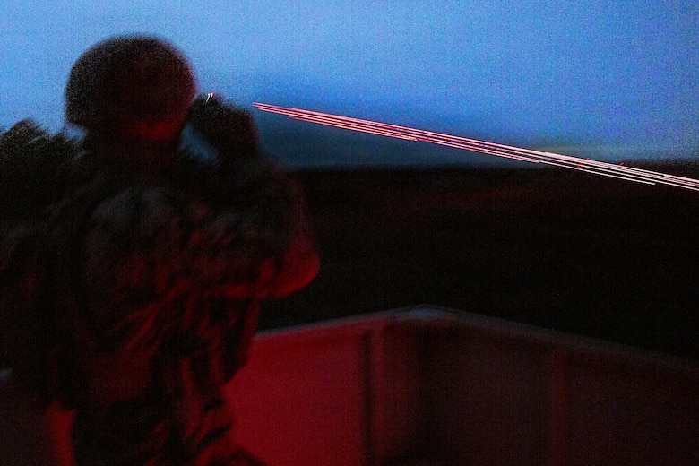 U.S. Marine Corps Sgt. Parker Jarrant, a joint terminal attack controller with 3rd Battalion, 14th Marines, 4th Marine Division, Marine Forces Reserve, watches as close air support hits its target during a tactical air-control party (TACP) exercise at Rattlesnake Range, Hattiesburg, Mississippi, Dec. 2, 2025. TACP exercises prepare prospective joint terminal attack controllers and joint fires observers for formal schools. (U.S. Marine Corps photo by Lance Cpl. Payton Goodrich)