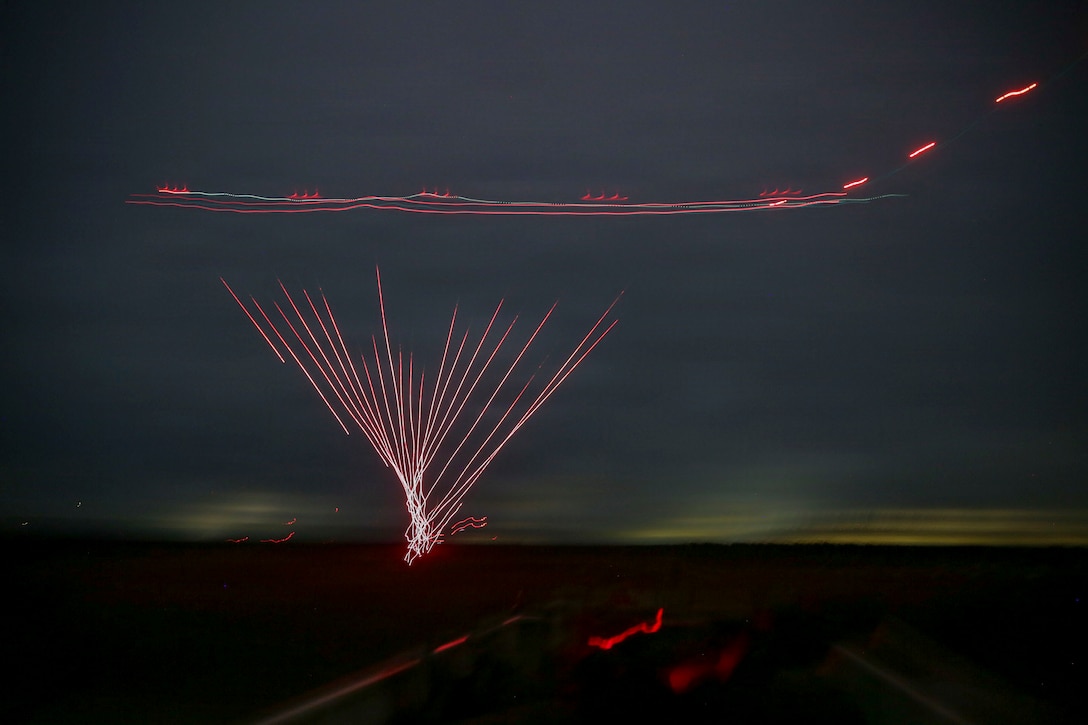 U.S. Marines with 3rd Naval Gunfire Liaison Company, Force Headquarters Group, Marine Forces Reserve, watch incoming close air support hit its target during a tactical air-control party (TACP) exercise at Rattlesnake Range, Hattiesburg, Mississippi, Dec. 2, 2025. TACP exercises prepare prospective joint terminal attack controllers and joint fires observers for formal schools. (U.S. Marine Corps photo by Lance Cpl. Payton Goodrich)