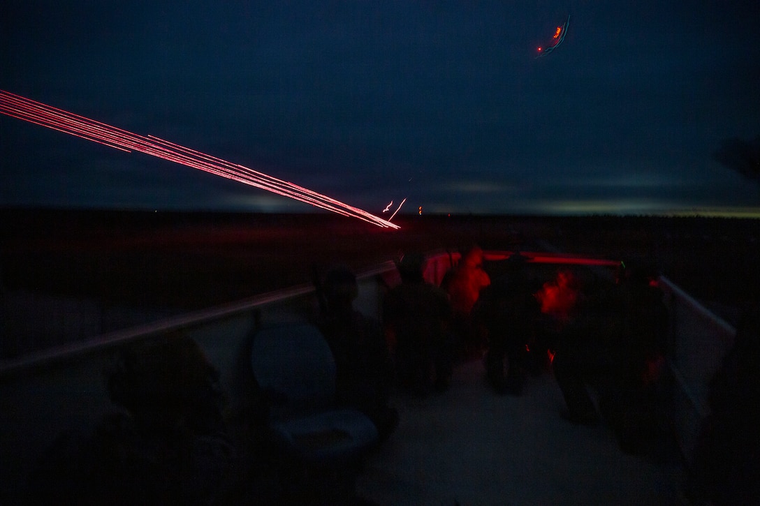 U.S. Marines with 3rd Naval Gunfire Liaison Company, Force Headquarters Group, Marine Forces Reserve, watch incoming close air support hit its target during a tactical air-control party (TACP) exercise at Rattlesnake Range, Hattiesburg, Mississippi, Dec. 2, 2025. TACP exercises prepare prospective joint terminal attack controllers and joint fires observers for formal schools. (U.S. Marine Corps photo by Lance Cpl. Payton Goodrich)