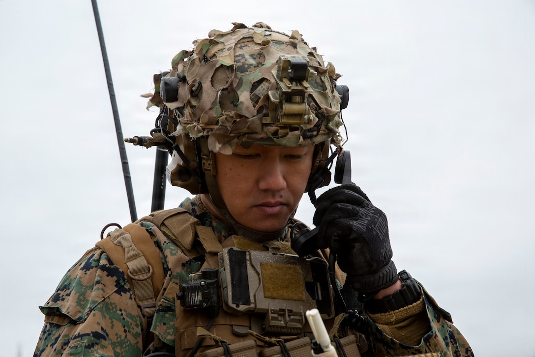 U.S. Marine Corps Staff Sgt. Brian Wu, a joint tactical air controller with 4th Naval Gunfire Liaison Company, Force Headquarters Group, Marine Forces Reserve, calls for close air support during a tactical air-control party (TACP) exercise at Rattlesnake Range, Hattiesburg, Mississippi, Dec. 2, 2025. TACP exercises prepare prospective joint terminal attack controllers and joint fires observers for formal schools. (U.S. Marine Corps photo by Lance Cpl. Payton Goodrich)
