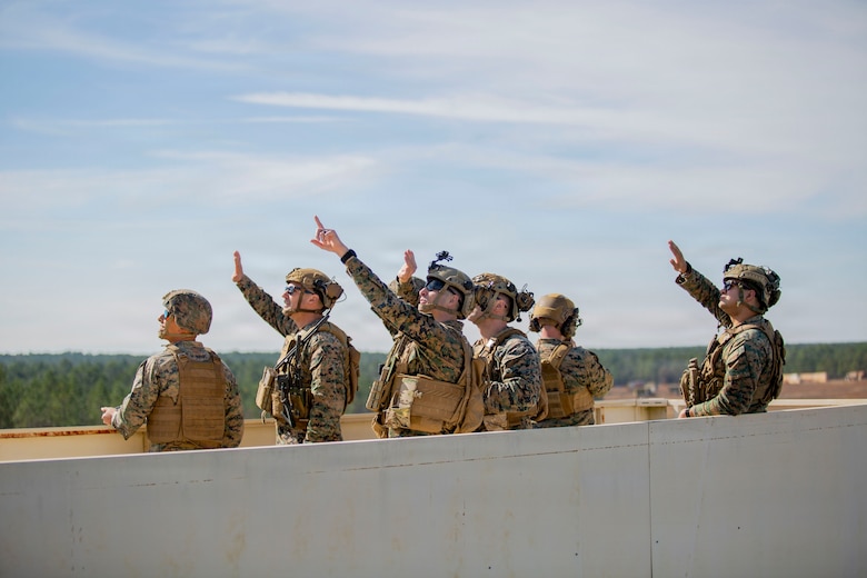 U.S. Marines with 3rd Naval Gunfire Liaison Company, Force Headquarters Group, Marine Forces Reserve, observe an F/A-18C Hornet aircraft with Marine Fighting Squadron (VMFA) 112 during a tactical air-control party (TACP) exercise at Rattlesnake Range, Hattiesburg, Mississippi, Dec. 3, 2025. TACP exercises prepare prospective joint terminal attack controllers and joint fires observers for formal schools. (U.S. Marine Corps photos by Lance Cpl. Payton Goodrich)