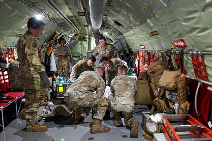 A group of 59th Medical Wing Airmen place a simulated patient and secure their liter onto a KC-135 Stratotanker, Joint Base San Antonio-Kelly Field Annex, Texas, June 18, 2024.