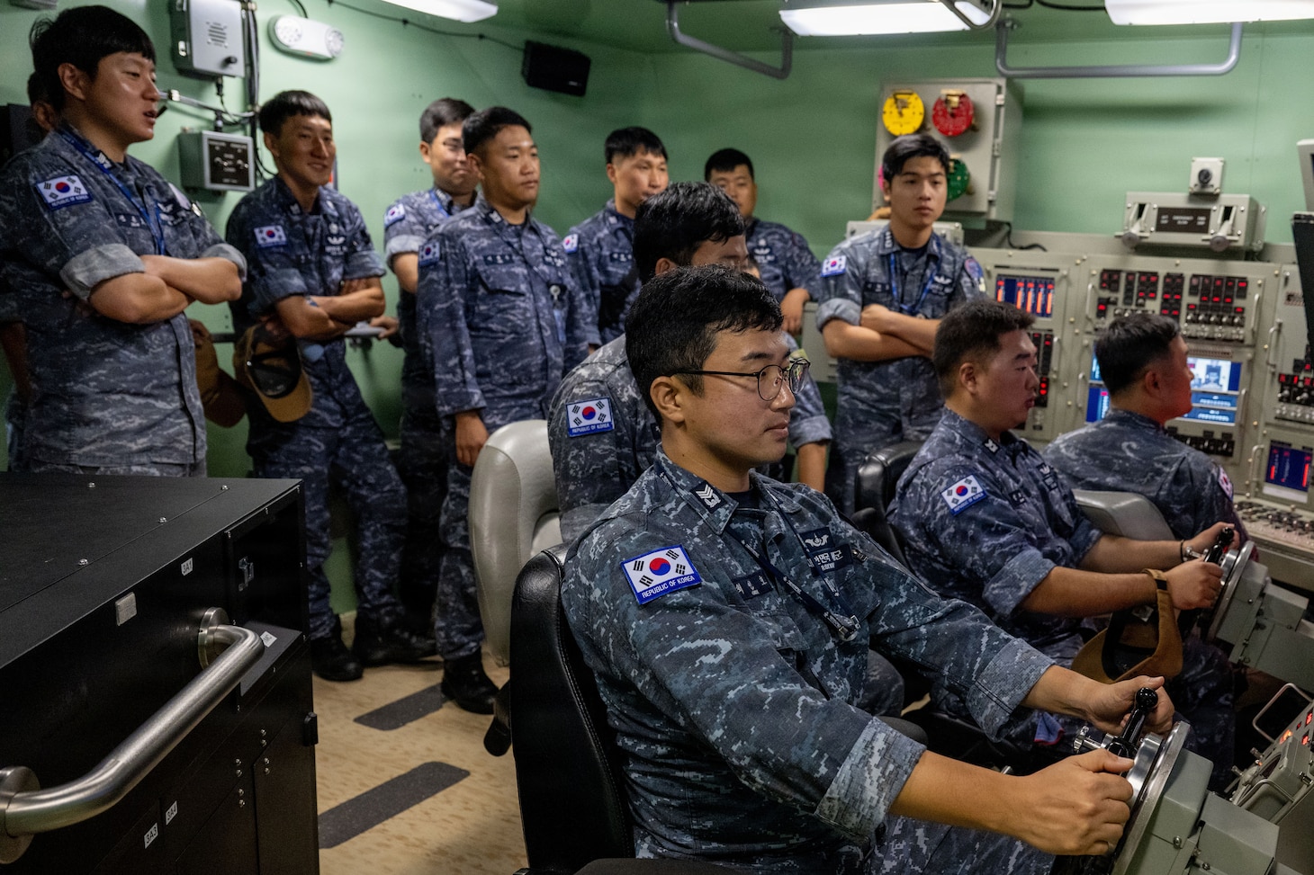 Crew members assigned to the Republic of Korea (ROK) Submarine Ahn Mu (SS 085) participate in a submarine training evolution during a visit to Naval Submarine Training Center Pacific (NSTCP) Detachment Guam, Dec. 1, 2025.