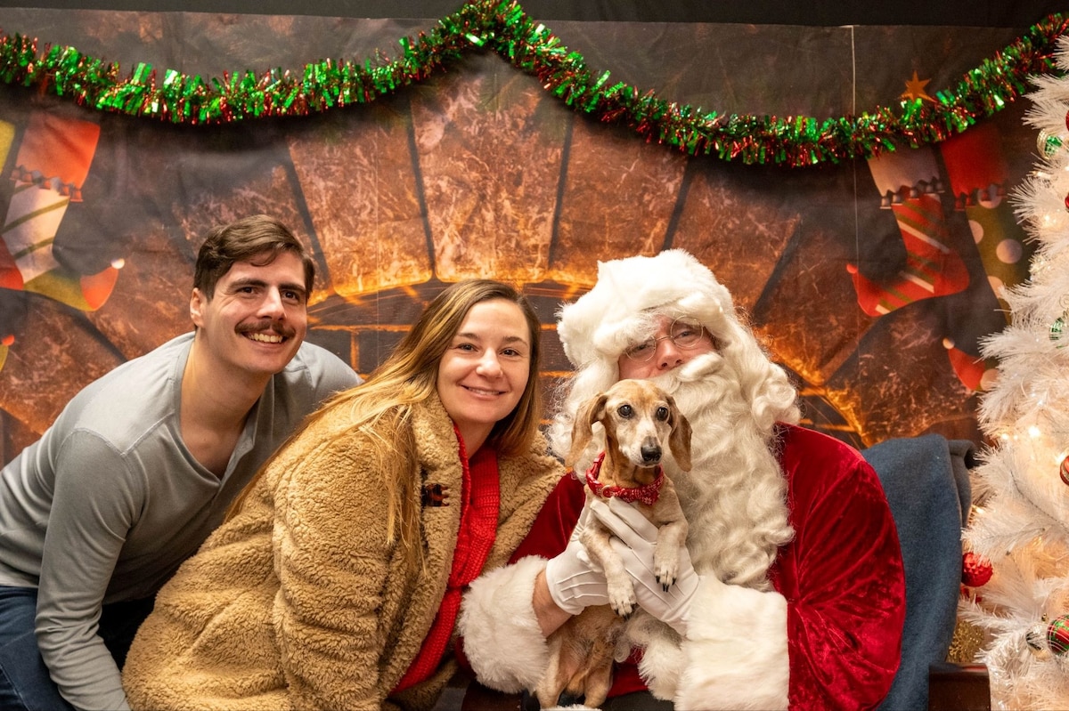 Volunteers and their pet pose for a photo with Santa Claus during the 2025 Santa Paws event at Misawa Air Base, Japan, Dec. 6, 2025. The event offered the Misawa community a playful holiday experience with their furry family members, reinforcing the sense of connection that supports the 35th Fighter Wing’s unified mission. (U.S. Air Force photo by Airman 1st Class Jessel Fabara)