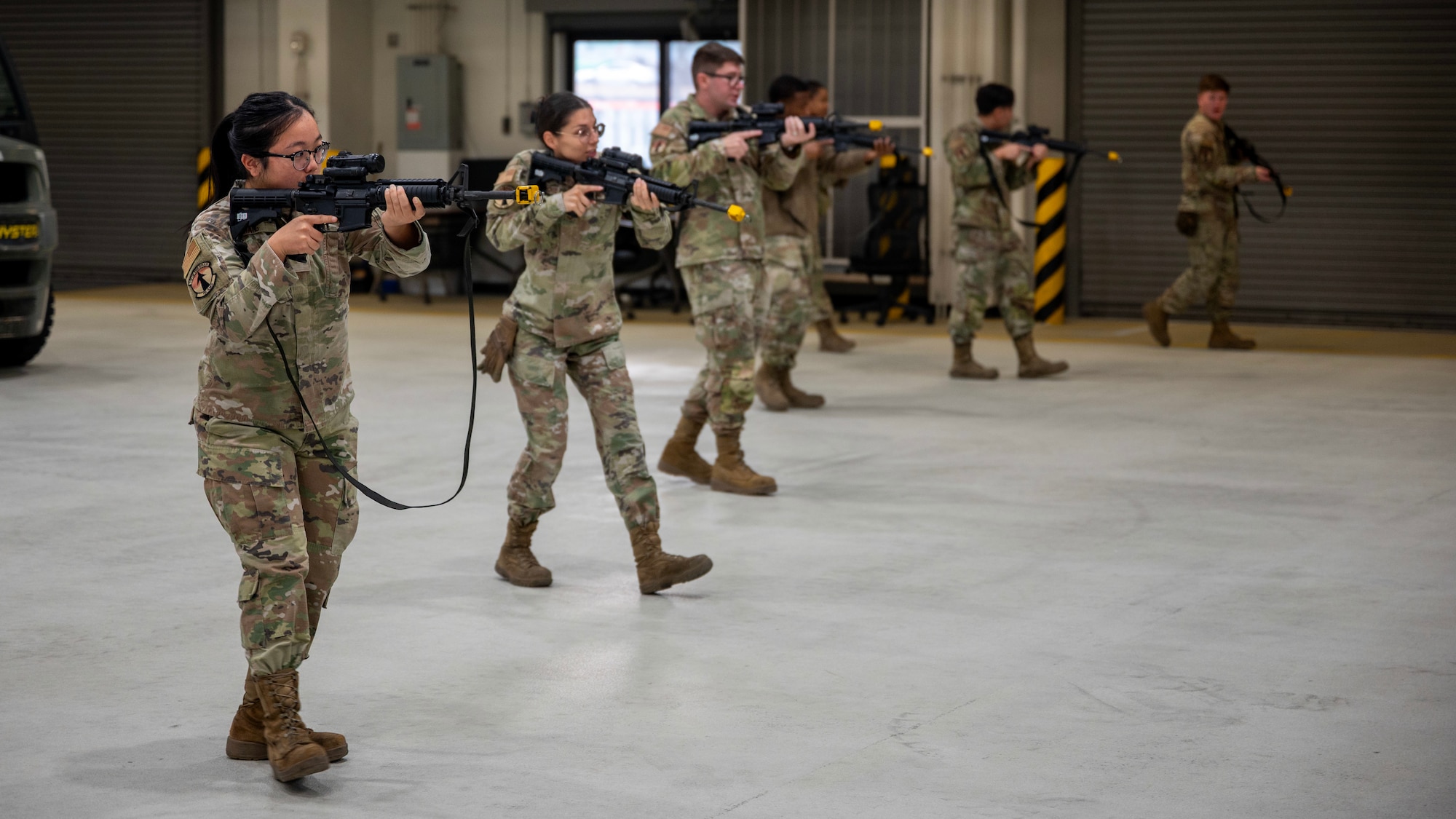 Members of the 731st Air Mobility Squadron participate in asset defense training during MUSTANG RODEO 26-1 at Osan Air Base, Republic of Korea, Dec. 9, 2025. MUSTANG RODEO is three days of focused unit training where squadrons plan and execute part task events to practice the skills Osan Airmen need during contingency operations. (U.S. Air Force photo by Staff Sgt. Sarah Williams)