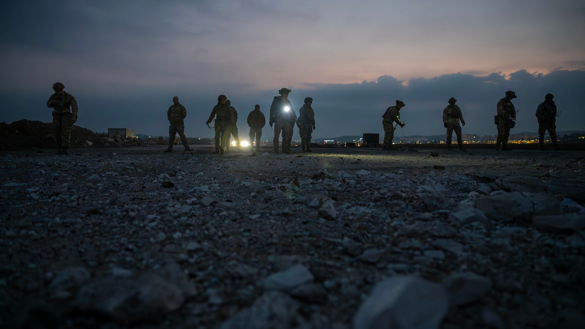 Members of the 51st Civil Engineer Squadron explosive ordnance disposal place C-4 during MUSTANG RODEO 26-1 at Osan Air Base, Republic of Korea, Dec. 10, 2025. MUSTANG RODEO is a week of focused unit training where squadrons plan and execute part task events to practice the skills Osan Airmen need during contingency operations. (U.S. Air Force photo by Staff Sgt. Sarah Williams)