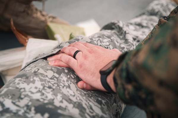 U.S. Navy Lt. Terrence Hamilton, a medical physician assigned to Marine Rotational Force-Southeast Asia, I Marine Expeditionary Force, applies pressure on a simulated wound during a tactical combat casualty care subject matter expert exchange as part of exercise Marine Air Support Activity 2025 at Marine Base Camp Rodolfo, Palawan, Philippines, Oct. 13, 2025. TCCC is a training program for non-medical personnel to have knowledge and skills to render life-saving medical aid in the absence of medical personnel in combat scenarios.  MASA 25 is an annual joint Philippine and U.S. military exercise focused on mutual defense, strengthening relationships, and rehearsing emerging aviation concepts. Hamilton is a native of Minnesota. (U.S. Marine Corps photo by Sgt. Luis Agostini)