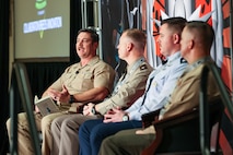 Captain delivers speech to crowd of people at event.