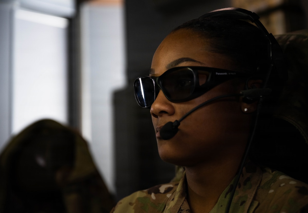 Senior Airman Jasmine Miller, 344th Air Refueling Squadron boom operator, prepares to refuel a KC-46 Pegasus above North Carolina.
