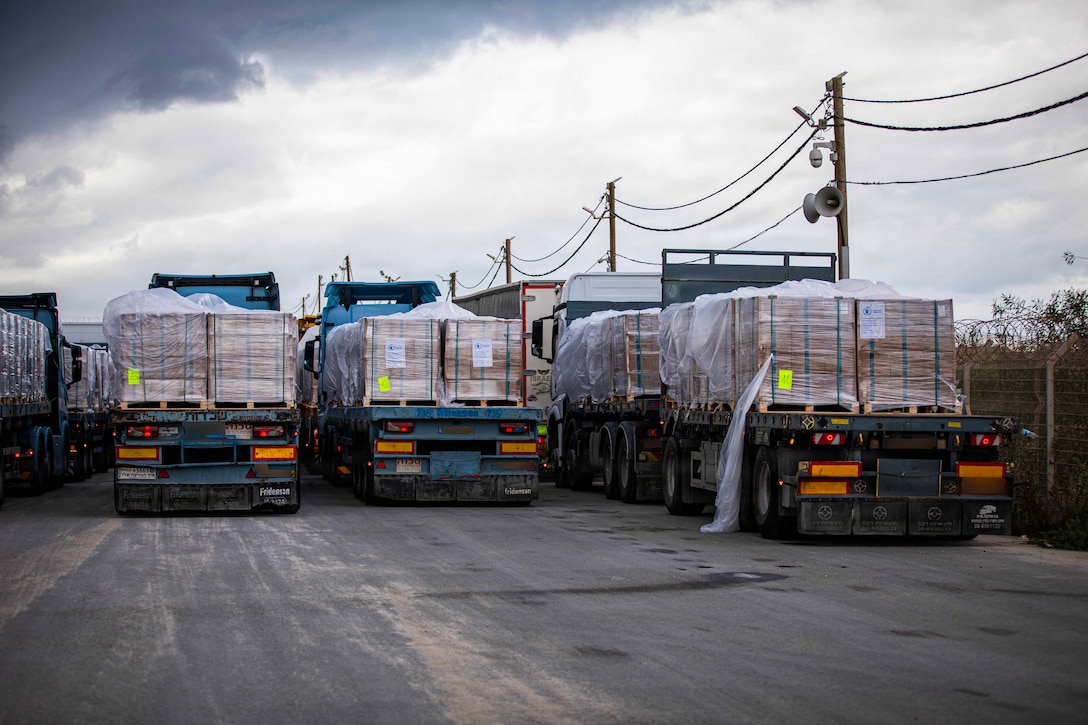 Trucks carrying humanitarian aid are staged at the Zikim Crossing Point on Nov. 25, 2025, in Israel. The United States is working with the international community to facilitate the flow of humanitarian assistance to civilians in Gaza. (U.S. Army photo by Staff Sgt. Michael Ito.)