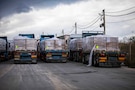 Trucks carrying humanitarian aid are staged at the Zikim Crossing Point on Nov. 25, 2025, in Israel. The United States is working with the international community to facilitate the flow of humanitarian assistance to civilians in Gaza. (U.S. Army photo by Staff Sgt. Michael Ito.)
