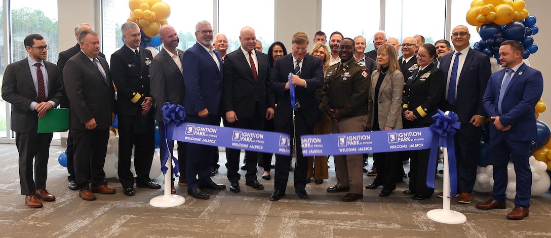 Governor of Mississippi Tate Reeves cuts the ribbon officially opening the new I-ATLAS building at the Stennis Airport, Kiln, Mississippi, December 5, 2025. I-ATLAS held a ribbon-cutting and Memorandum of Understanding signing ceremony to celebrate the standing up of the new joint endeavor. (U.S. Army photo by Keesha Robinson)