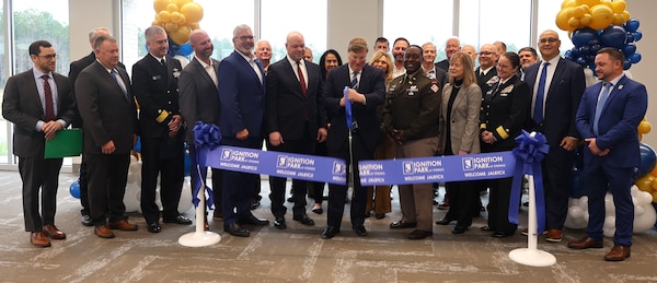 Governor of Mississippi Tate Reeves cuts the ribbon officially opening the new I-ATLAS building at the Stennis Airport, Kiln, Mississippi, December 5, 2025. I-ATLAS held a ribbon-cutting and Memorandum of Understanding signing ceremony to celebrate the standing up of the new joint endeavor. (U.S. Army photo by Keesha Robinson)