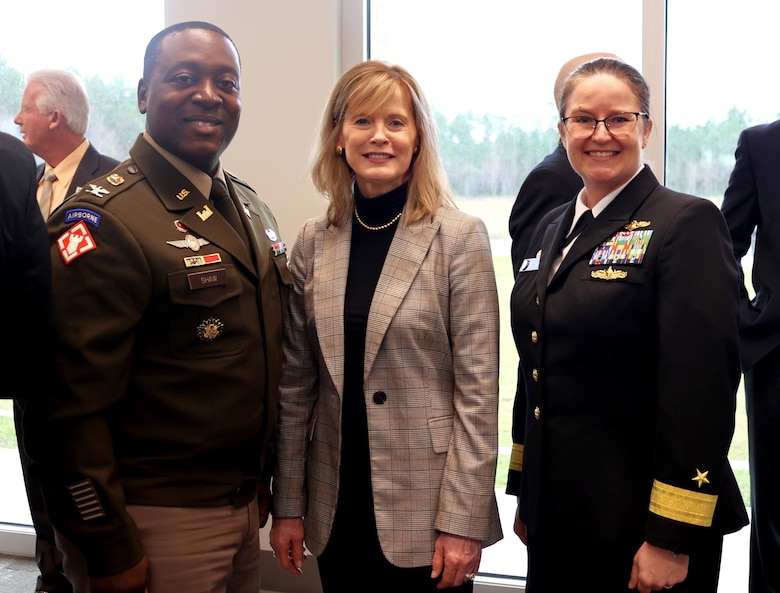 USACE Mobile District Commander Col. Kelcey Shaw, ERDC Director Beth Fleming, and Commander of the Naval Meteorology and Oceanography Command Rear Admiral Erin Acosta pose for a photo at the ribbon cutting and Memorandum of Understanding signing ceremony at the Stennis Airport, Kiln, Mississippi, December 5, 2025. The ceremony celebrated the standing up and opening of I-ATLAS a new joint endeavor of USACE, ERDC, NMOC, NOAA and the U.S. Geological Survey. (U.S. Army photo by Keesha Robinson)