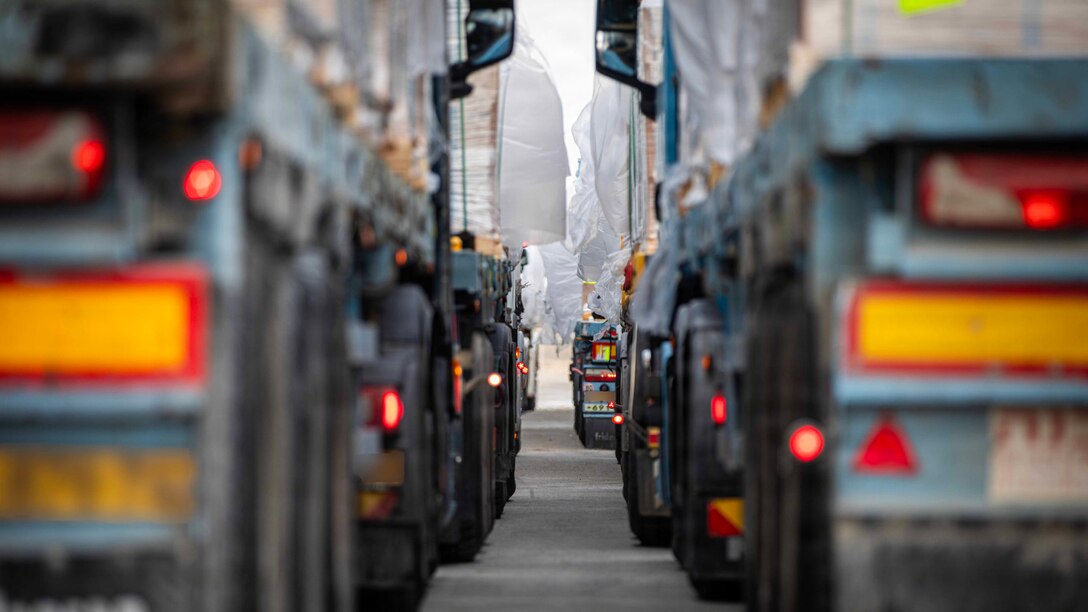 Trucks carrying humanitarian aid are staged at the Zikim Crossing Point on Nov. 25, 2025, in Israel. The United States is working with the international community to facilitate the flow of humanitarian assistance to civilians in Gaza. (U.S. Army Photo by Staff Sgt. Mike Ito)