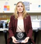 NSWCPD Financial Improvement Audit Remediation (FIAR) Lead Maria Amoroso displays her certificate of completion for the Naval Sea Systems Command (NAVSEA) Journey Level Leadership (JLL) Program. The JLL program aims to develop advanced leadership skills, offer a strategic view of NAVSEA’s enterprise, and boost mission effectiveness through cross-organizational collaboration. (U.S. Navy photo by Spc. Najee Tate-Milton)