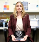 NSWCPD Financial Improvement Audit Remediation (FIAR) Lead Maria Amoroso displays her certificate of completion for the Naval Sea Systems Command (NAVSEA) Journey Level Leadership (JLL) Program. The JLL program aims to develop advanced leadership skills, offer a strategic view of NAVSEA’s enterprise, and boost mission effectiveness through cross-organizational collaboration. (U.S. Navy photo by Spc. Najee Tate-Milton)
