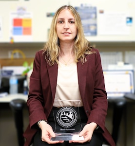 NSWCPD Financial Improvement Audit Remediation (FIAR) Lead Maria Amoroso displays her certificate of completion for the Naval Sea Systems Command (NAVSEA) Journey Level Leadership (JLL) Program. The JLL program aims to develop advanced leadership skills, offer a strategic view of NAVSEA’s enterprise, and boost mission effectiveness through cross-organizational collaboration. (U.S. Navy photo by Spc. Najee Tate-Milton)