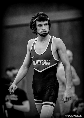 A person in a wresting outfit.