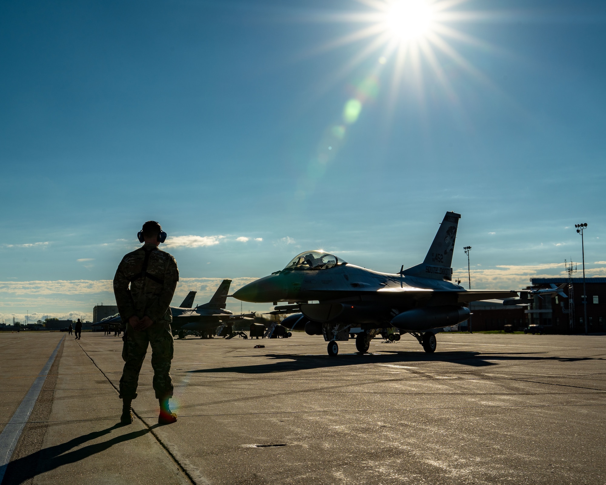 Staff Sgt. Mason Mathieu, a dedicated crew chief with the 114th Aircraft Maintenance Squadron, South Dakota Air National Guard, oversees tail 452 on the ramp as he prepares the jet for takeoff during operations marking its 10,000-flight hour milestone at Joe Foss Field, South Dakota, Oct. 17, 2025.