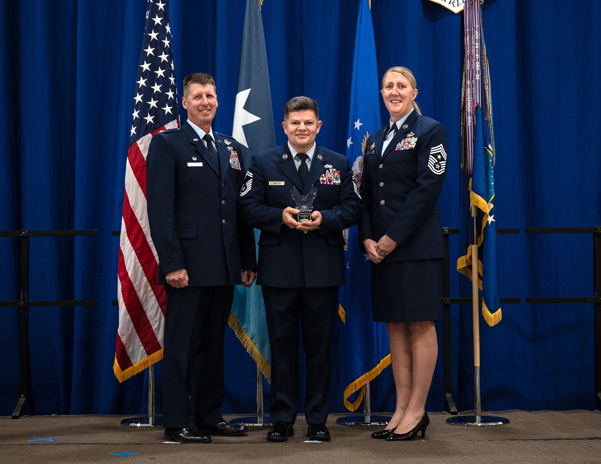 U.S. Air Force Senior Master Sgt. Adrian Meiers, 133rd Maintenance Group, accepts the Outstanding Airman of the Year award for the senior non-commissioned officer category in St. Paul, Minn., Dec. 6, 2025.